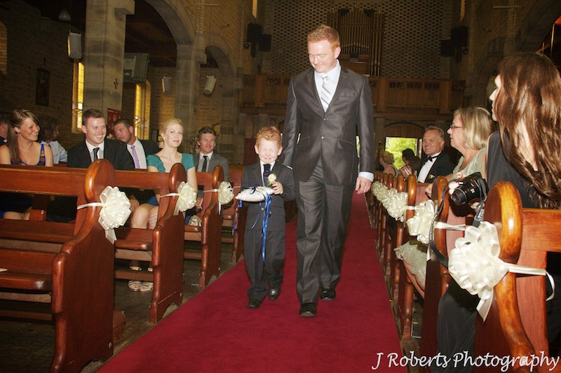 Paige boy being walked down the aisle by his father - wedding photography sydney